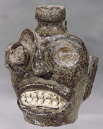 Southern folk art stoneware face jug by Thomas Davies circa 1860.