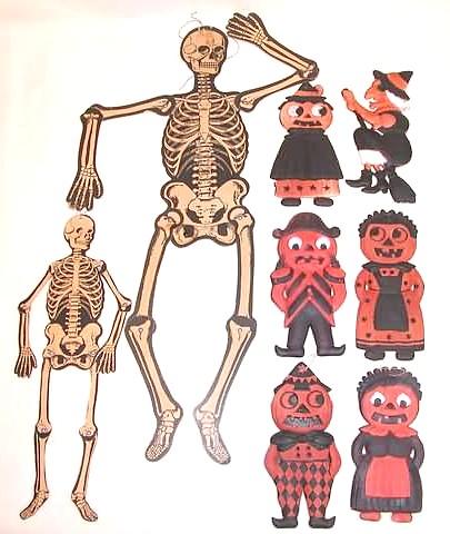 Die-cut Halloween decorations including jointed skeletons and pumpkin characters