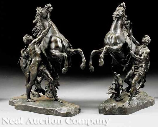 A pair of 19th century Continental bronze figures of the "Chevaux de Marly" or Marly horses, (sometimes incorrectly spelled Marley), after Guillaume Coustou (French, 1677 to 1746).