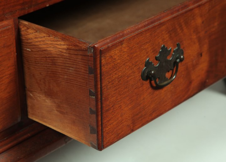 Furniture: A Chippendale blanket chest, Pennsylvania, late 18th century, walnut, pine, and poplar. Dovetailed case, two drawers, and bracket feet.
