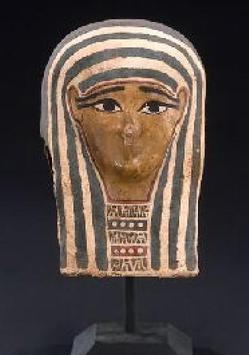 An Egyptian cartonnage mummy mask, Ptolemaic Period, circa 4th to 2nd century B.C., decorated with polychrome over gesso