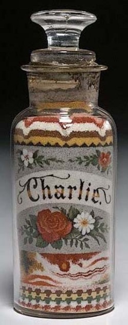 Andrew Clemens sand bottle apothecary jar with floral roses and daisies and the name Charlie
