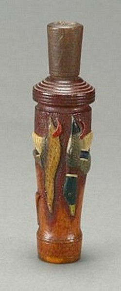 A carved [duck hunting] duck call by Charles Perdew (1874 to 1963) of Henry, Illinois.